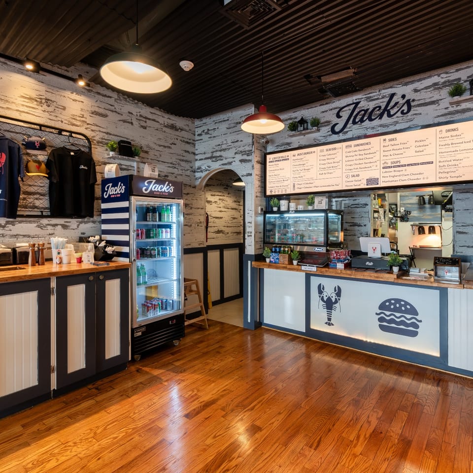 Jack's Summit merch wall and beverage cooler